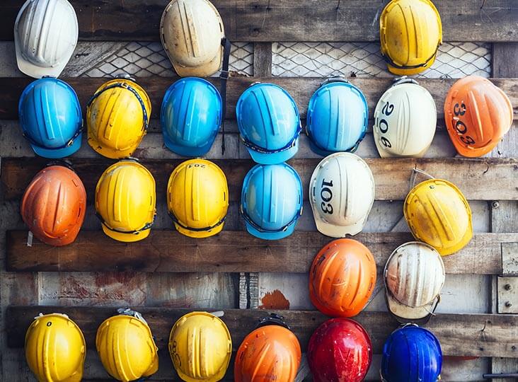 hardhats hung on a wall